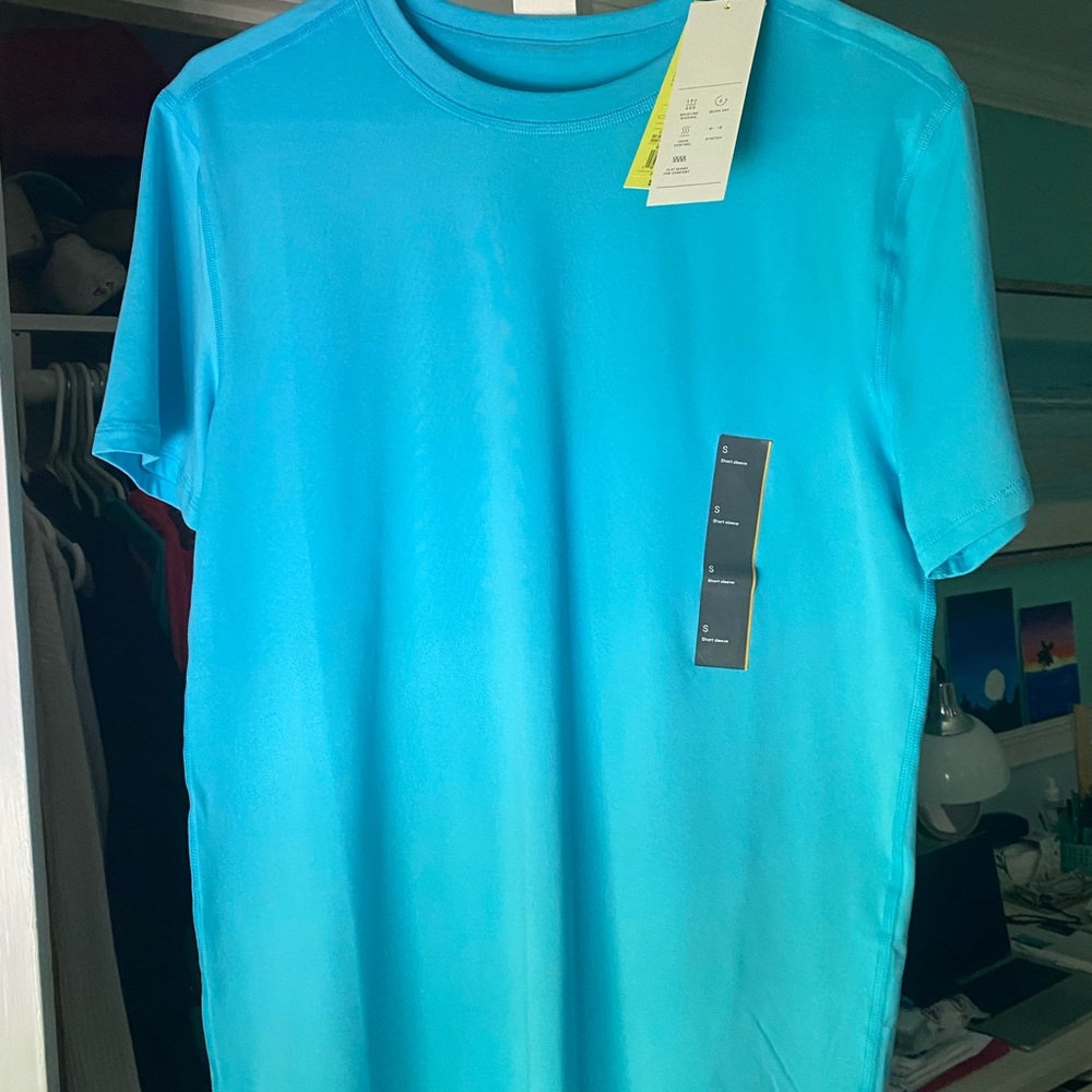 never worn blue athletic shirt! in great condition